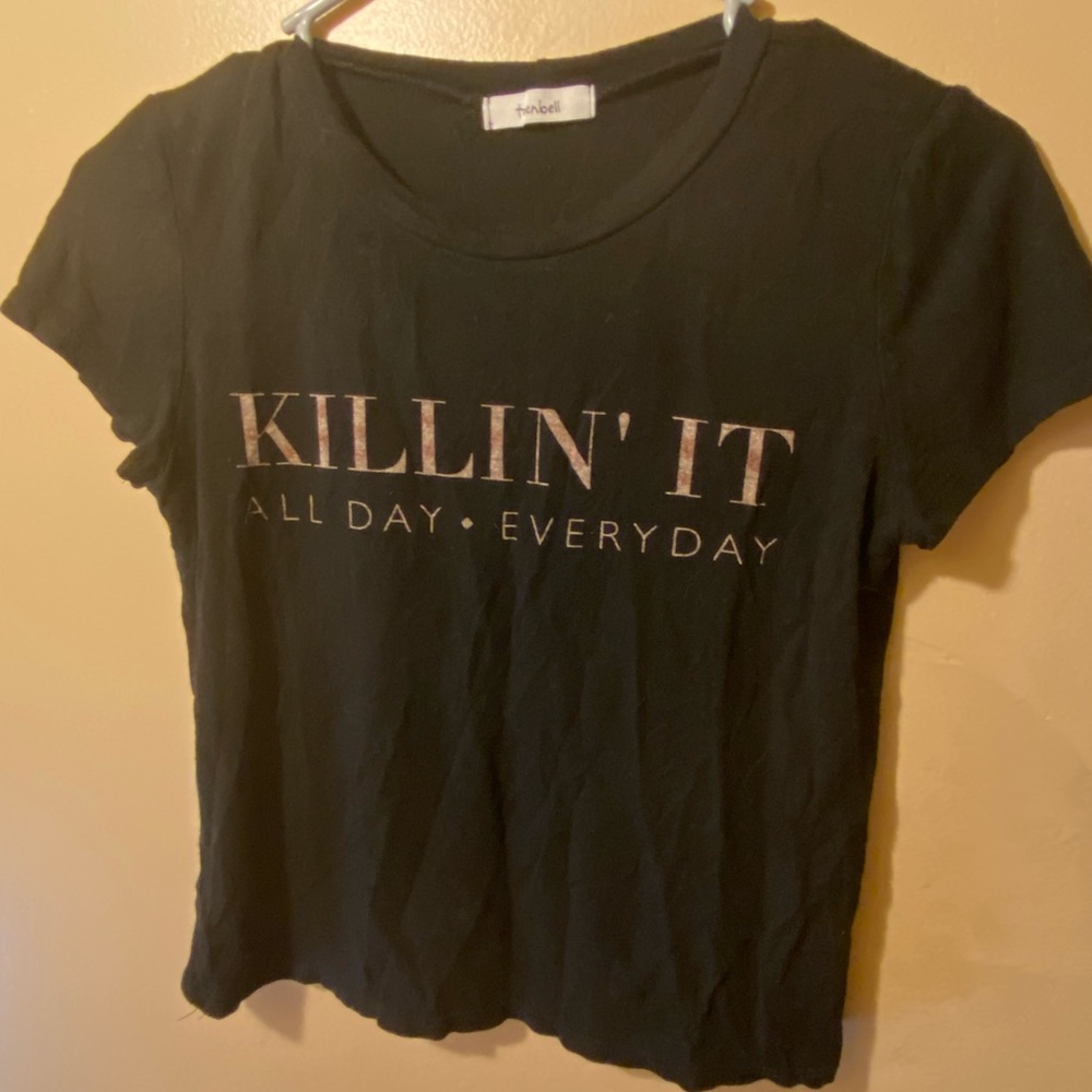 Med t-shirt on the verge of being a crop top but doesn’t show off too much